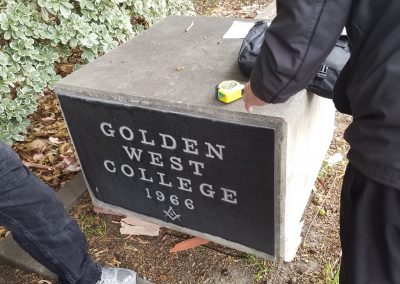 Measuring the old cornerstone in preparation for removal