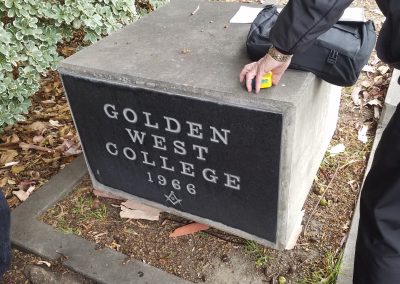 Measuring the old cornerstone in preparation for removal